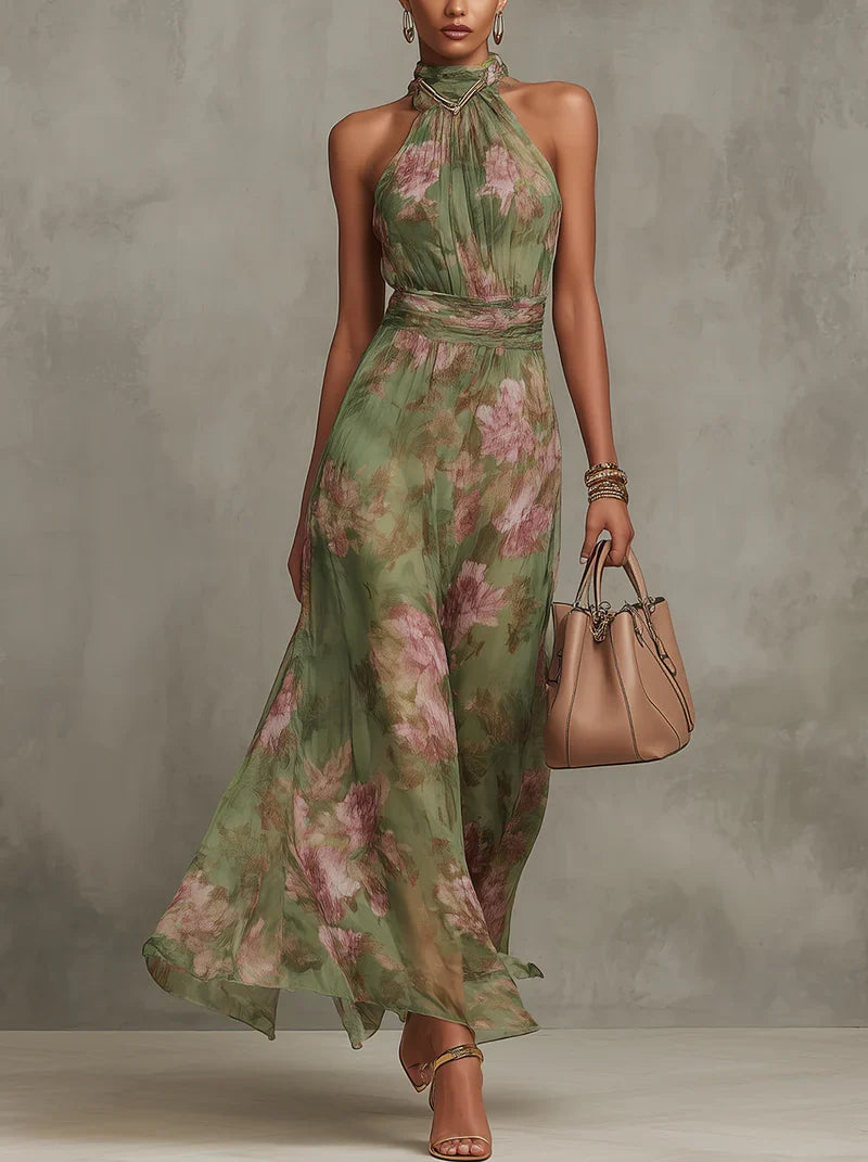 Halter neck floral maxi dress in green botanical print with adjustable neck ties and flowing skirt