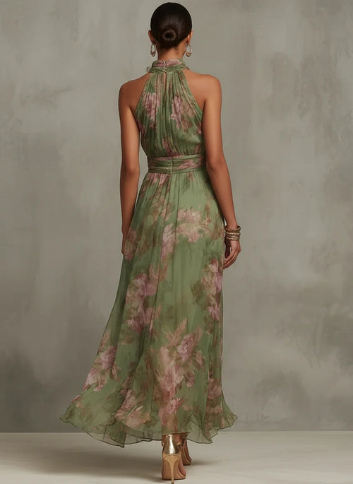 Side view of halter neck floral maxi dress showing gathered waist detail and full-length silhouette