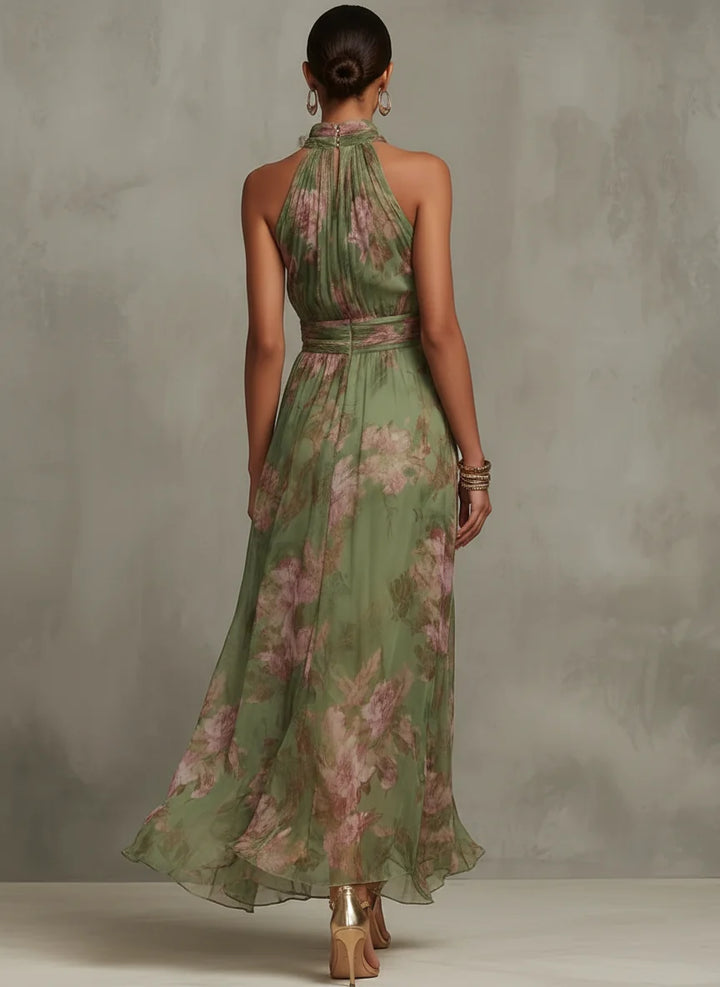Side view of halter neck floral maxi dress showing gathered waist detail and full-length silhouette