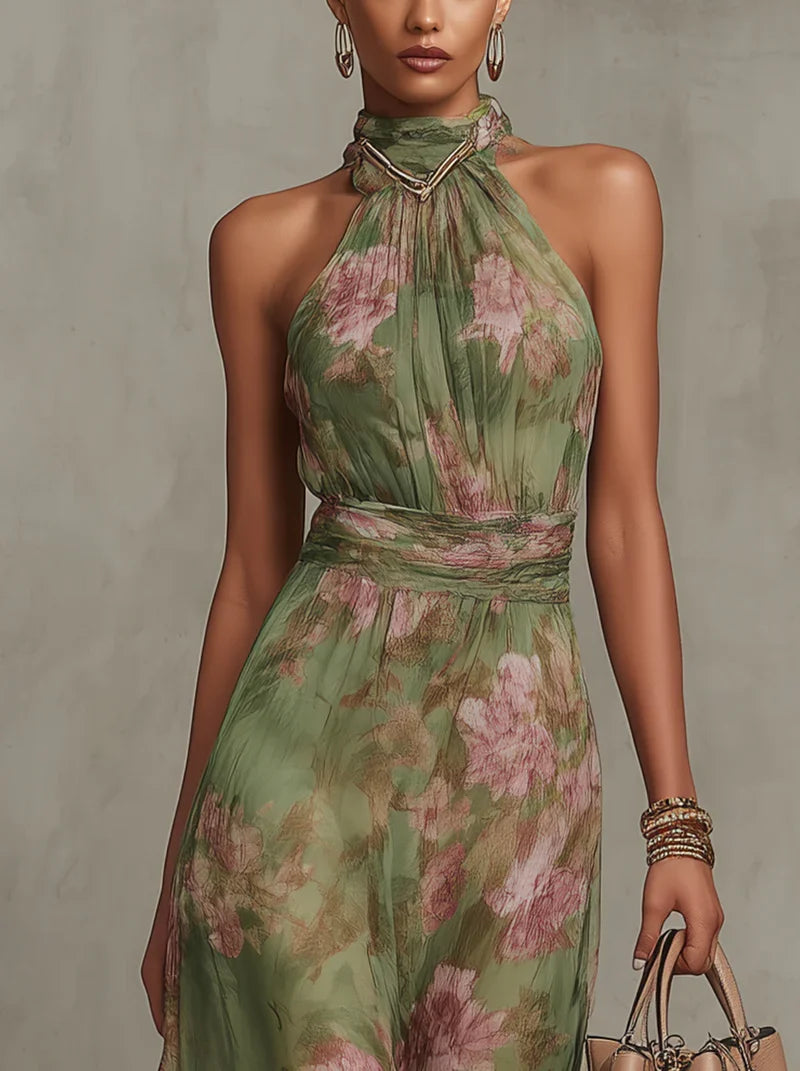 Close-up detail of botanical floral print in soft pink and green tones on maxi dress