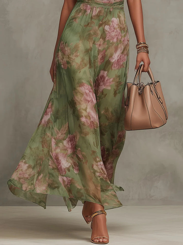 Back view of halter neck maxi dress showing adjustable tie closure and flowing drape