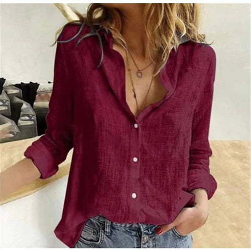Woman wearing a burgundy Comfortable Flattering Cotton Long Sleeve Shirt with button-front closure and V-neckline, paired with denim jeans