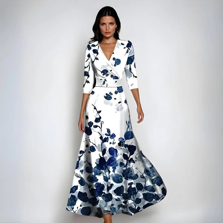 V-neck wrap bodice detail on floral maxi dress with cinched waist and A-line skirt
