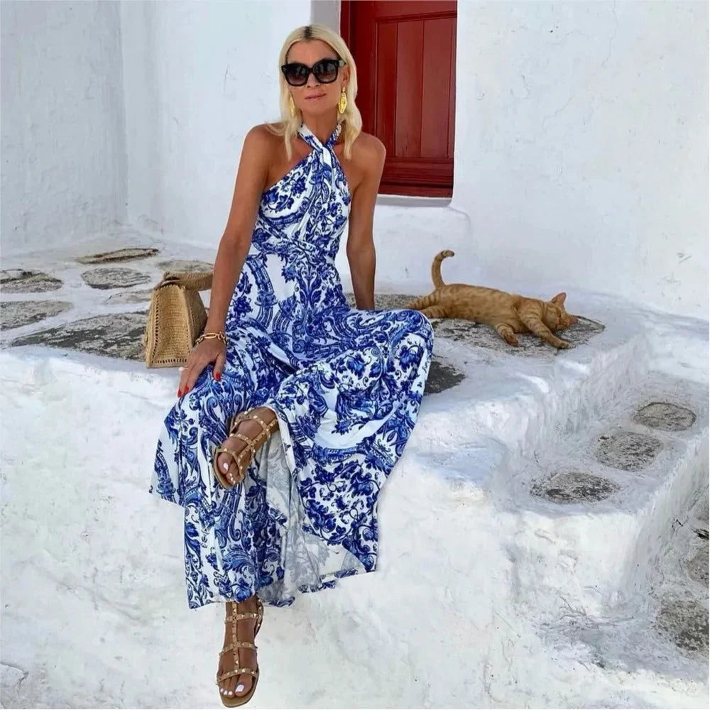 Close-up view of halter neck maxi dress showing printed pattern and flowing silhouette