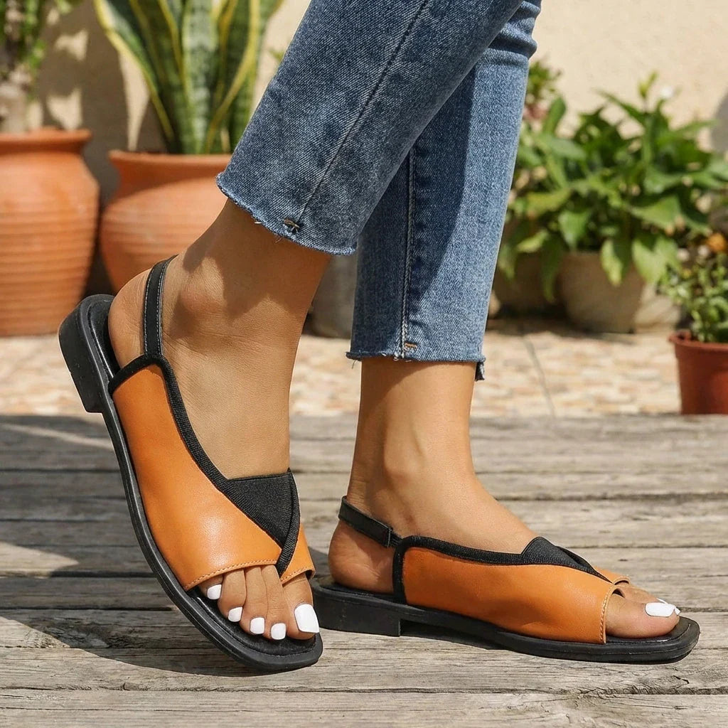 Close-up of women's toe-loop slingback sandals showing elasticated back strap and contoured footbed design
