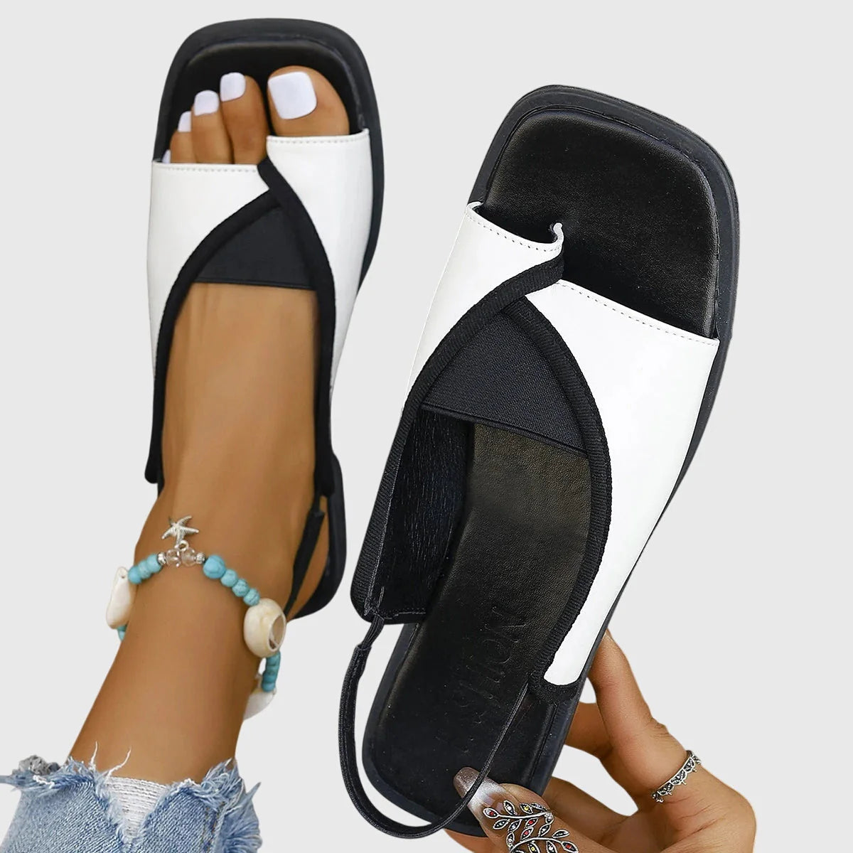Women's colourblock slingback sandals in snake print design with open toe and flat sole for summer wear