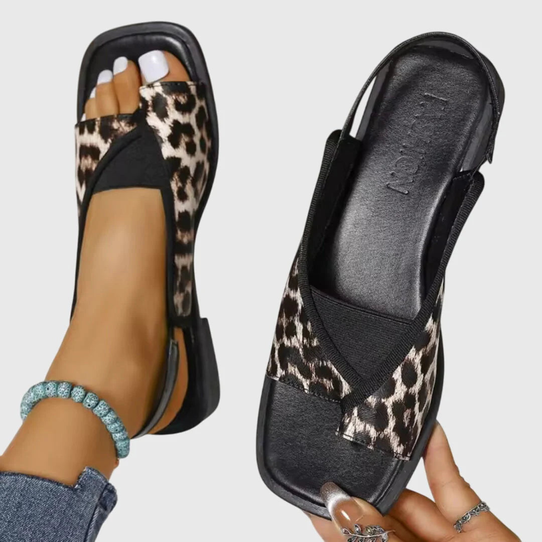 Women's flat slingback sandals in multicolour design showing contoured footbed and open toe construction