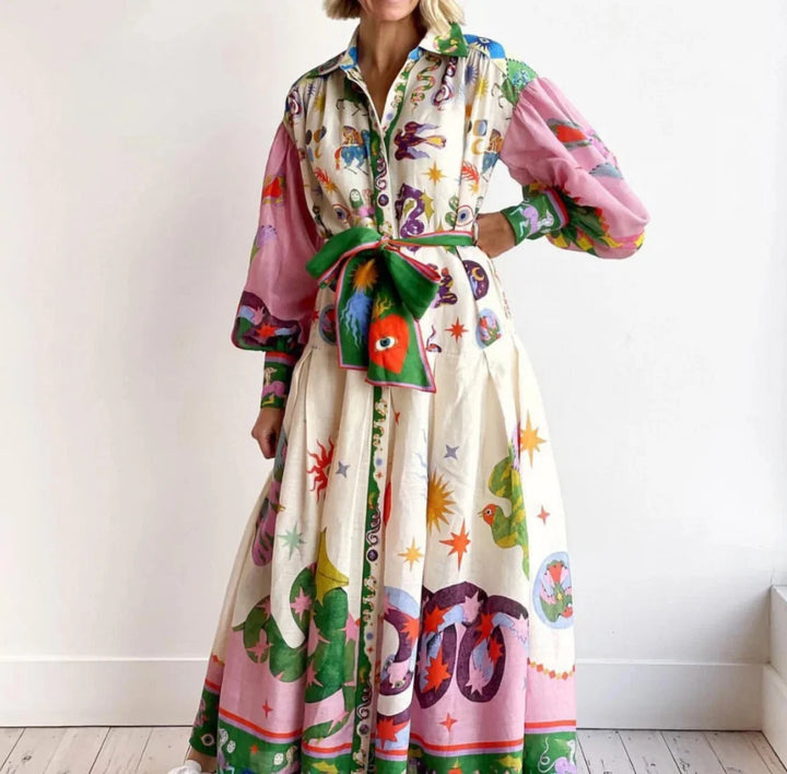 Women's printed maxi shirt dress with vibrant multicolour motifs and balloon sleeves tied at waist