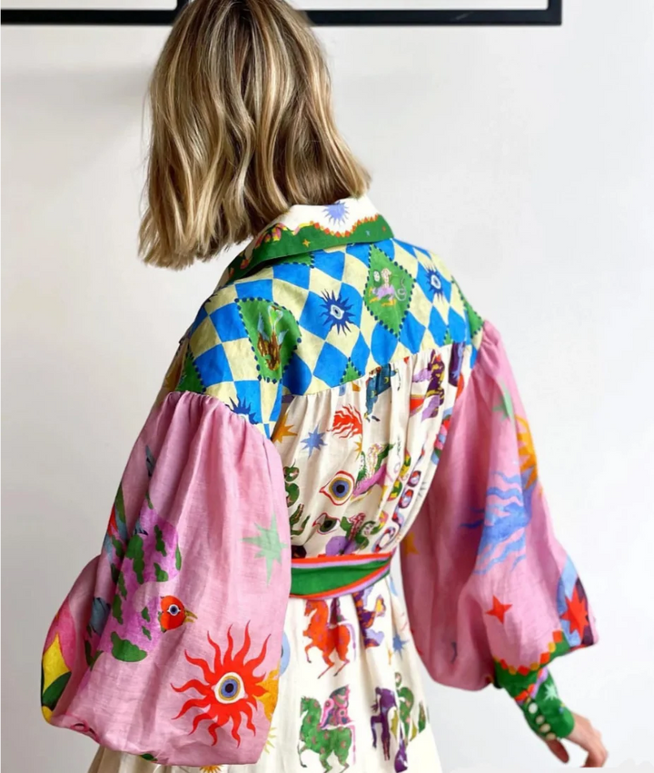 Full-length view of women's printed maxi shirt dress with belted waist and flowing skirt