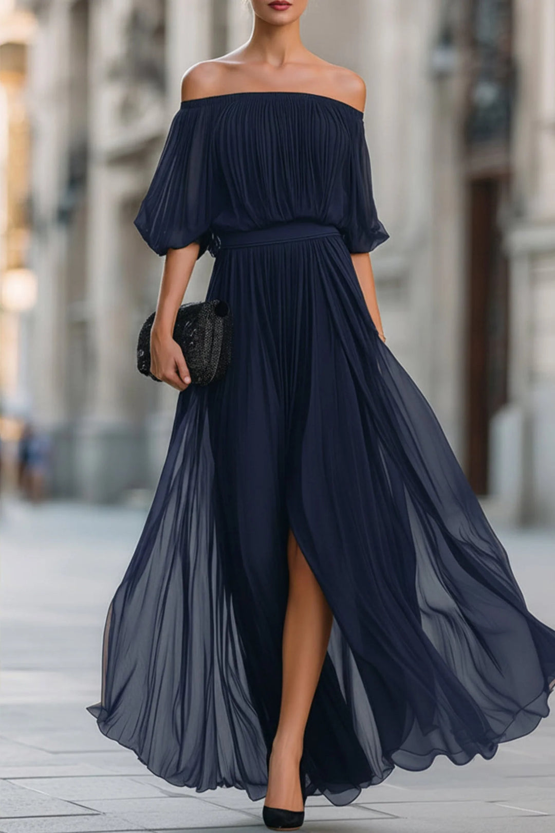 Black off-shoulder maxi dress with pleated chiffon skirt and front slit detail