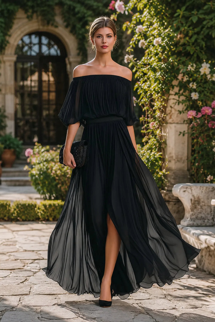 Black off-shoulder evening dress with pleated skirt and romantic silhouette