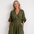 Wide-Leg Linen Jumpsuit For Women in olive green with deep V-neckline and cinched waist
