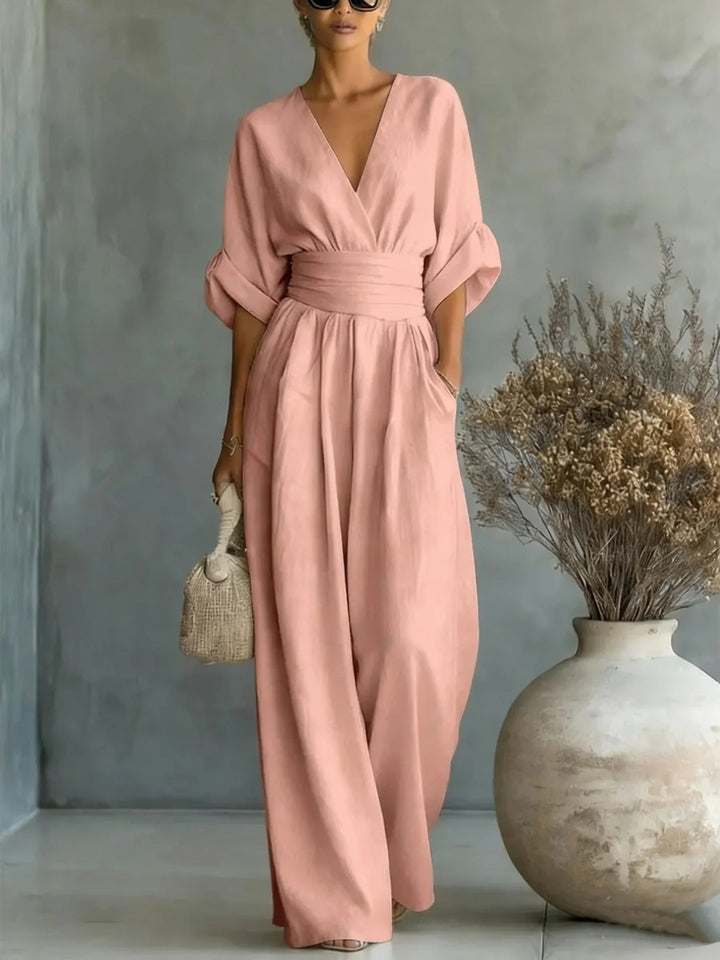 Women's linen jumpsuit with cinched waist and flowing wide-leg cut
