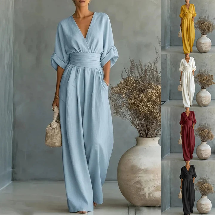 Front view of wide-leg linen jumpsuit showing pleated waistband and relaxed fit