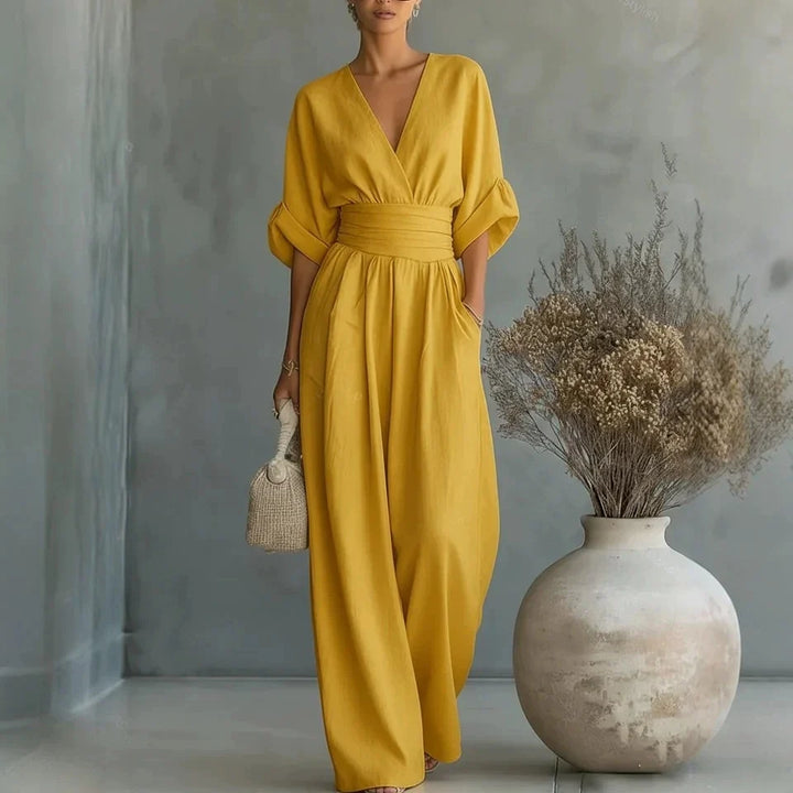 Close-up of cinched wrap waist detail on wide-leg linen jumpsuit