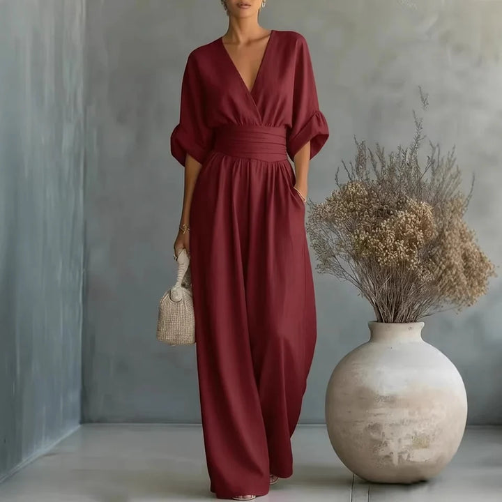 Model wearing wide-leg linen jumpsuit styled for casual daywear