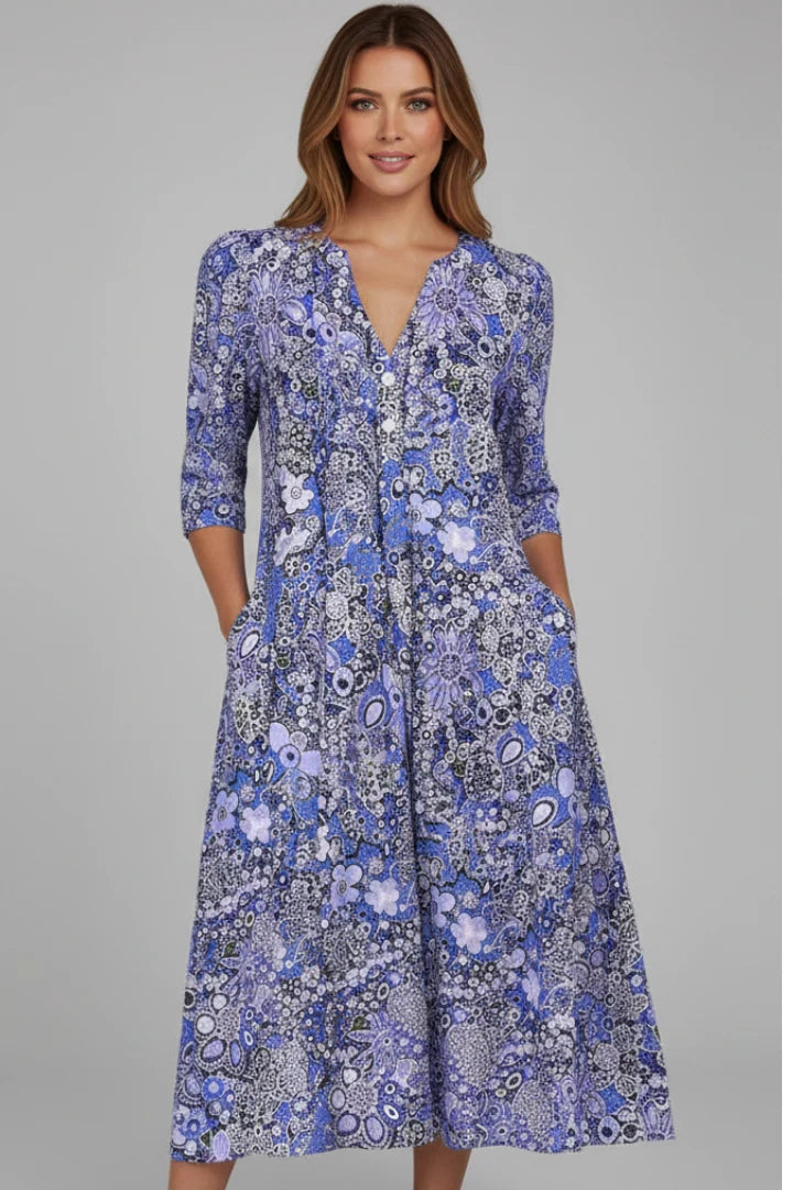 Front view of midi dress with V-shaped neckline and elbow-length sleeves in printed pattern