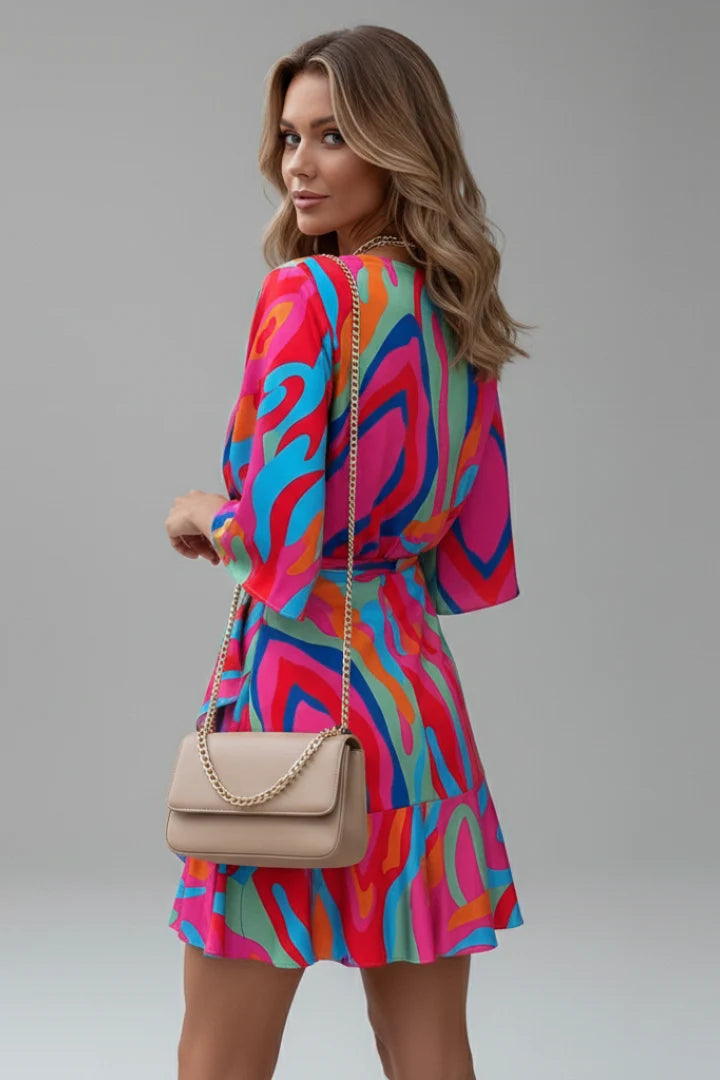 Colourful printed mini dress featuring V-neckline, wide sleeves, and self-tie waist belt