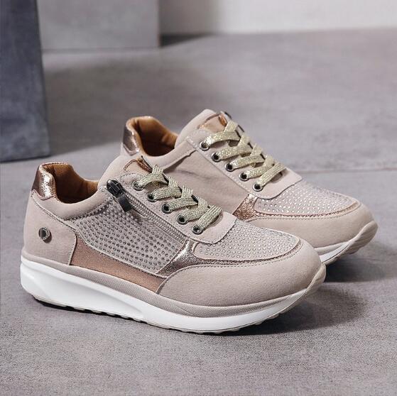Full view of orthopedic zip sneakers for women with metallic detailing and comfortable platform design
