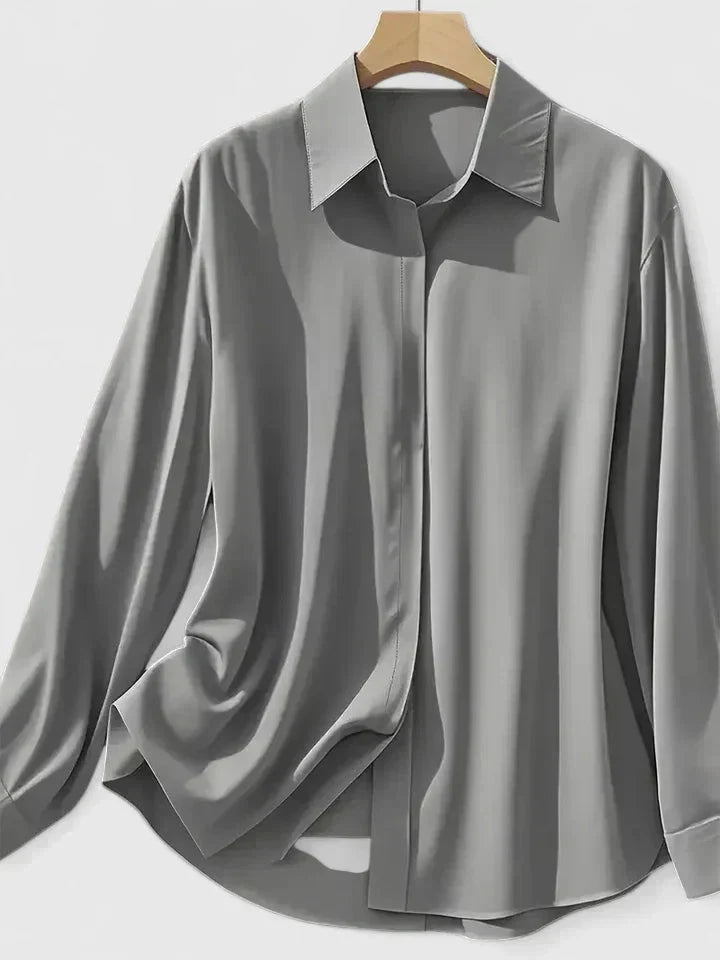 Side view of women's tailored shirt with relaxed fit and long sleeves for office wear