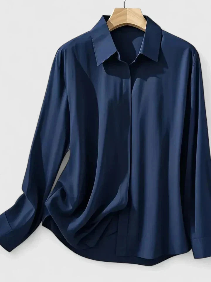 Detail of women's button-down shirt cuffs and smooth fabric finish for workwear