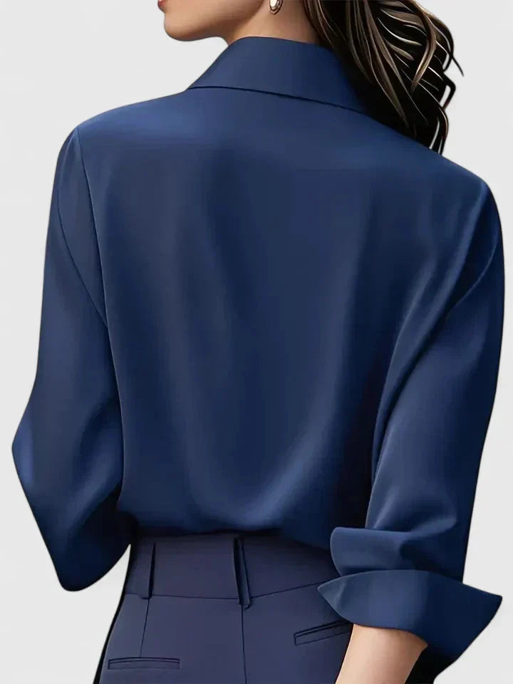 Back view of women's relaxed fit button-down shirt showing clean tailored lines