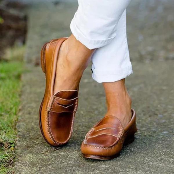Women's slip-on loafers in tan brown with penny loafer strap and contrast stitching detail on moc toe
