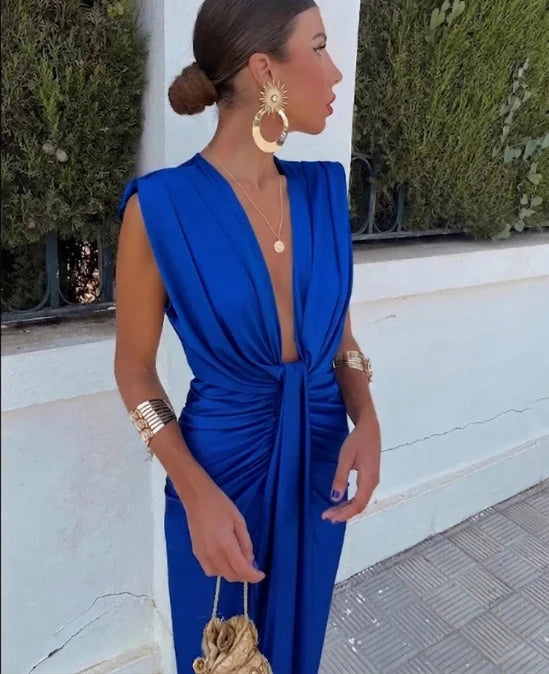 Back view of sleeveless V-neck midi dress with smooth structured fabric and fitted silhouette