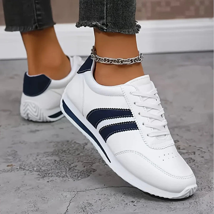 Detail of orthopedic sneaker construction showing breathable fabric upper and supportive sole design