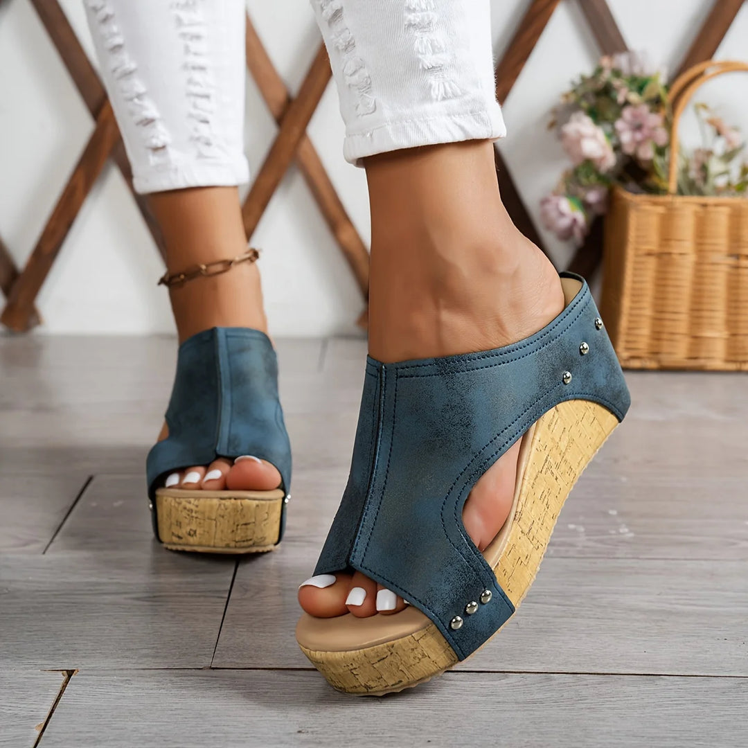 Black open-toe wedge sandals with cork platform and decorative studs for summer occasions