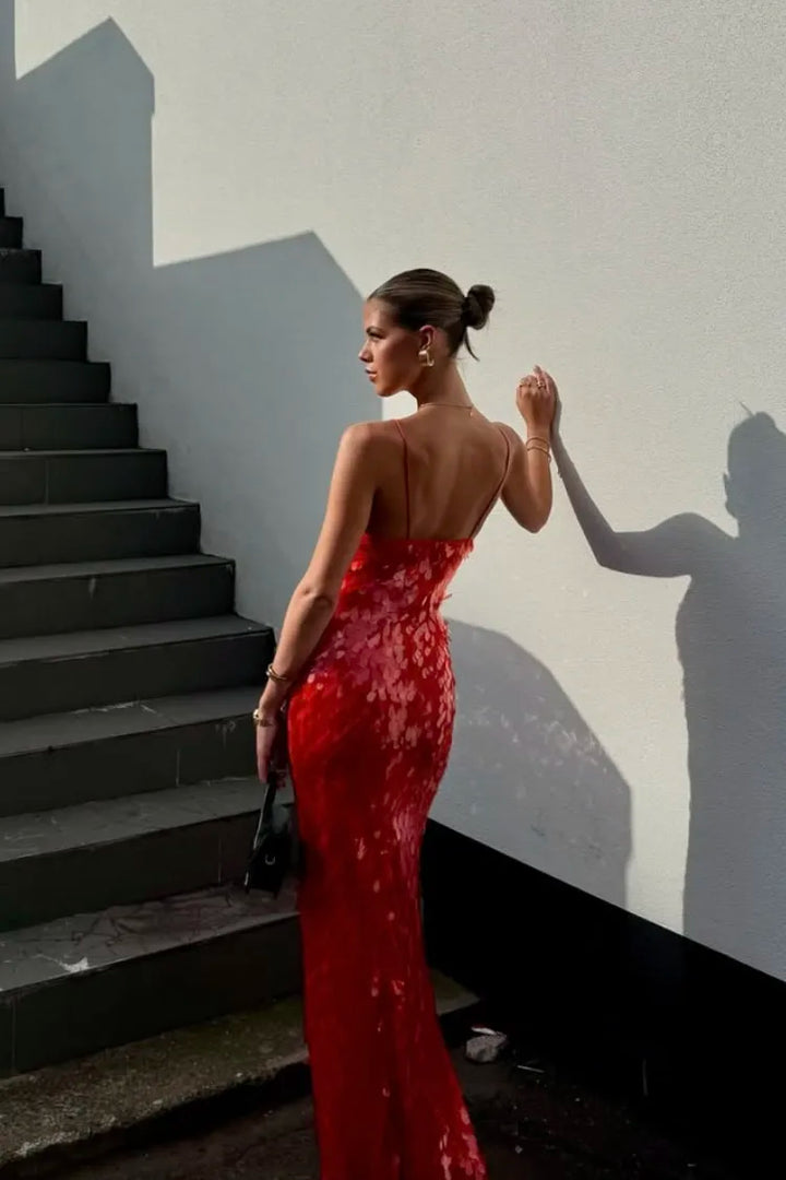 Red sequin maxi dress with all-over shimmer embellishment and halter straps for evening events