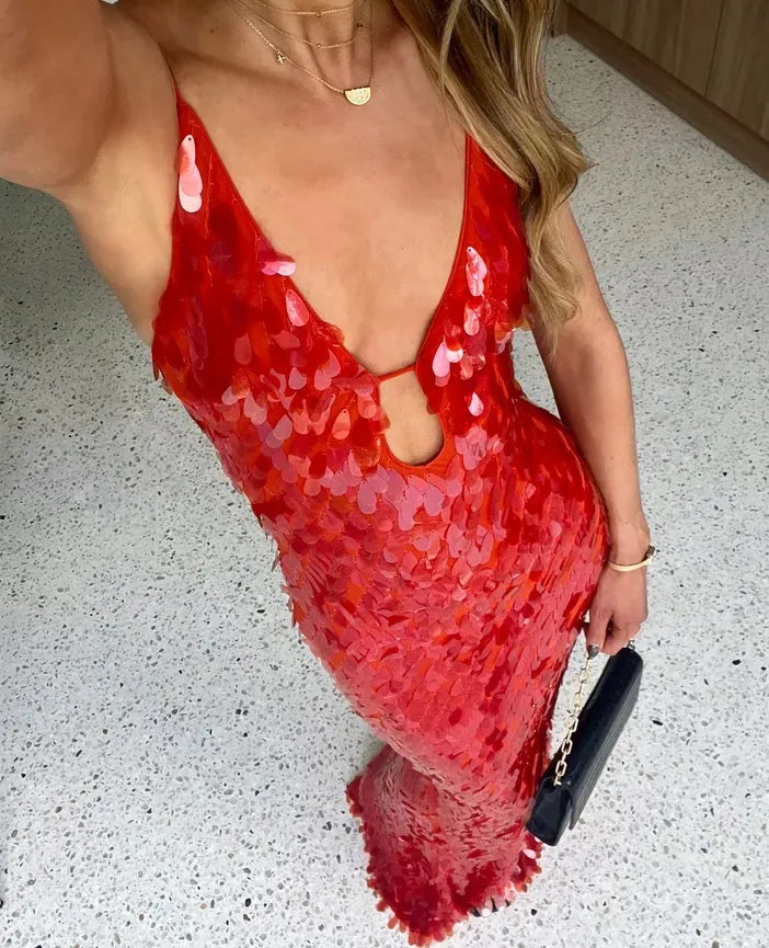Close-up of sequin evening wedding guest dress showing V-neck detail and fitted bodice construction