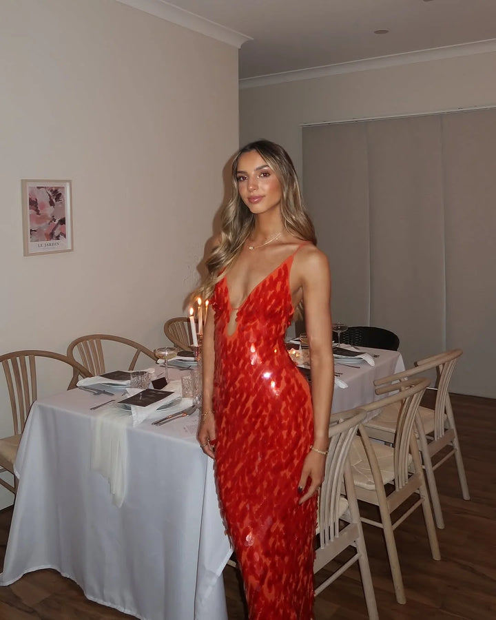 Mermaid silhouette sequin gown with flared hem and curve-hugging fit for special occasions