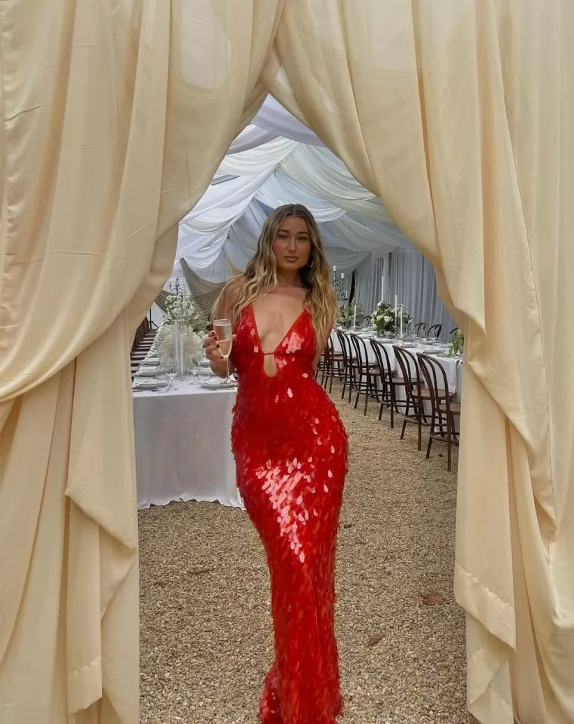 Side view of mermaid sequin gown showing fitted silhouette and elegant drape for events