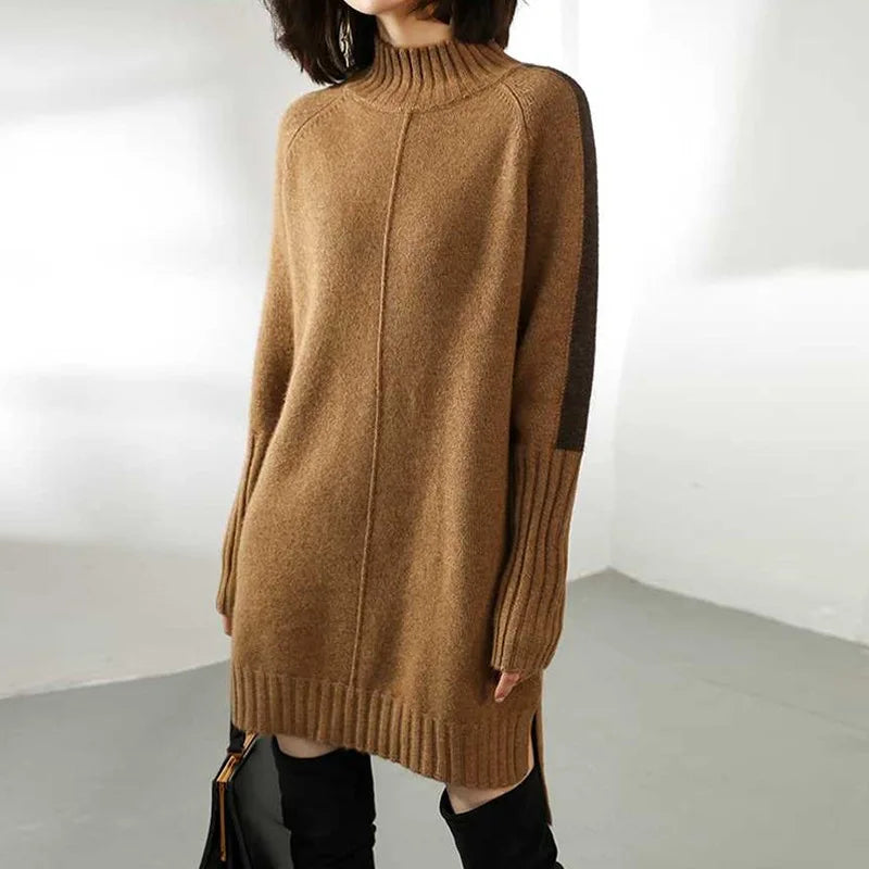 Side view of women's knit dress with side slit hem and high-low finish at thigh