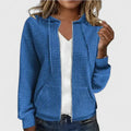 Side angle of women's quilted zip front jacket displaying relaxed fit and long sleeves