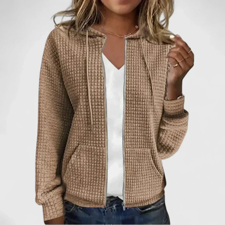 Back view of women's quilted zip front jacket showing structured silhouette and quilted texture