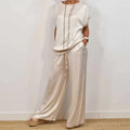 Women's Wide Leg Loose Fit Two-Piece Set in cream featuring relaxed short sleeve top and flowing wide leg trousers