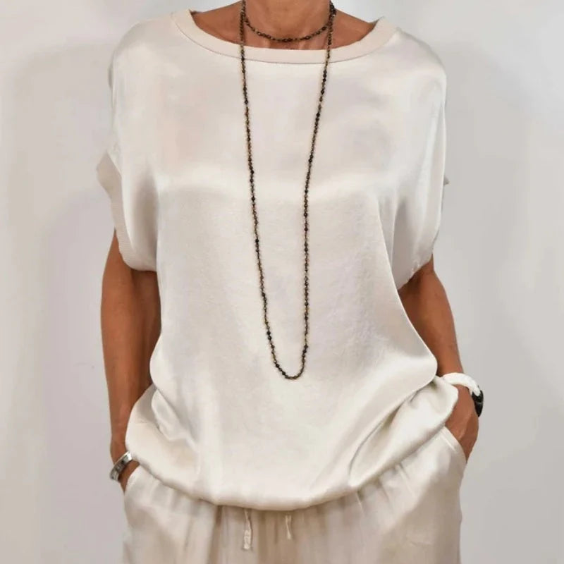 Back view showing relaxed fit top with dropped shoulders and wide leg trouser cut