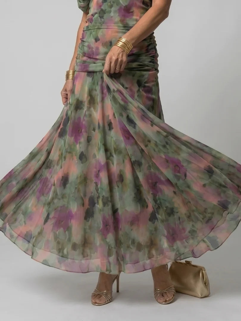 Side profile of maxi dress showing gathered bodice and sheer overlay