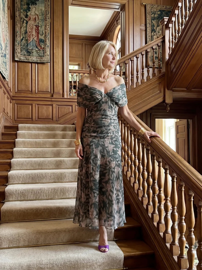Front view of floral maxi dress with draped neckline and A-line cut