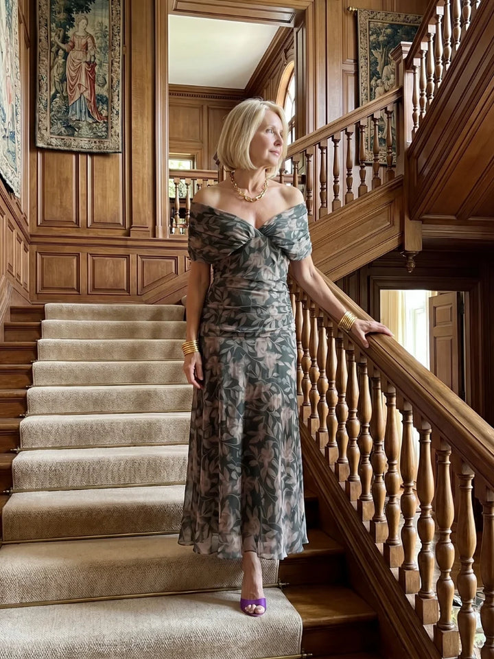 Front view of floral maxi dress with draped neckline and A-line cut
