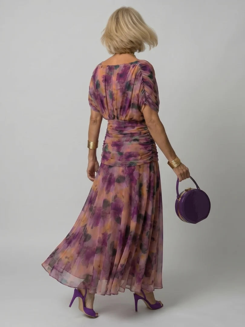 Detail of ruched bodice and watercolour floral print on maxi dress