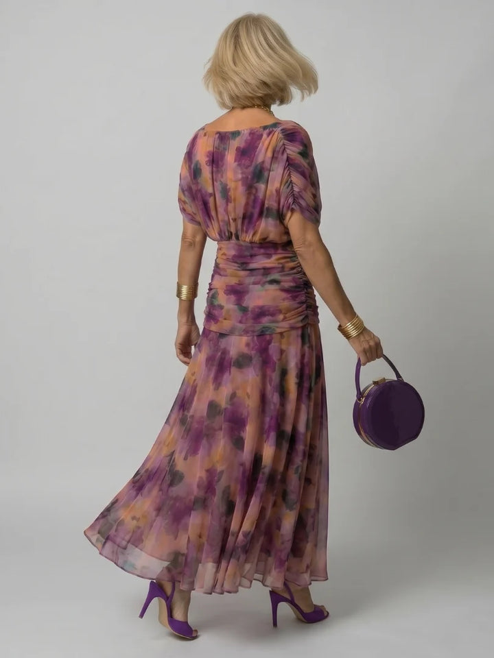 Detail of ruched bodice and watercolour floral print on maxi dress