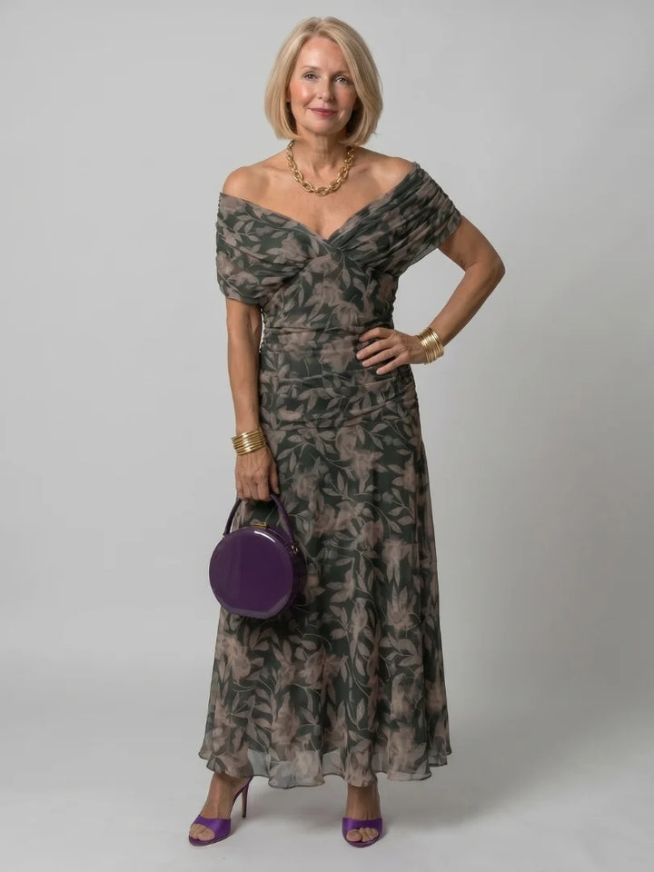 Back view of off-shoulder maxi dress with gathered waist and full-length skirt