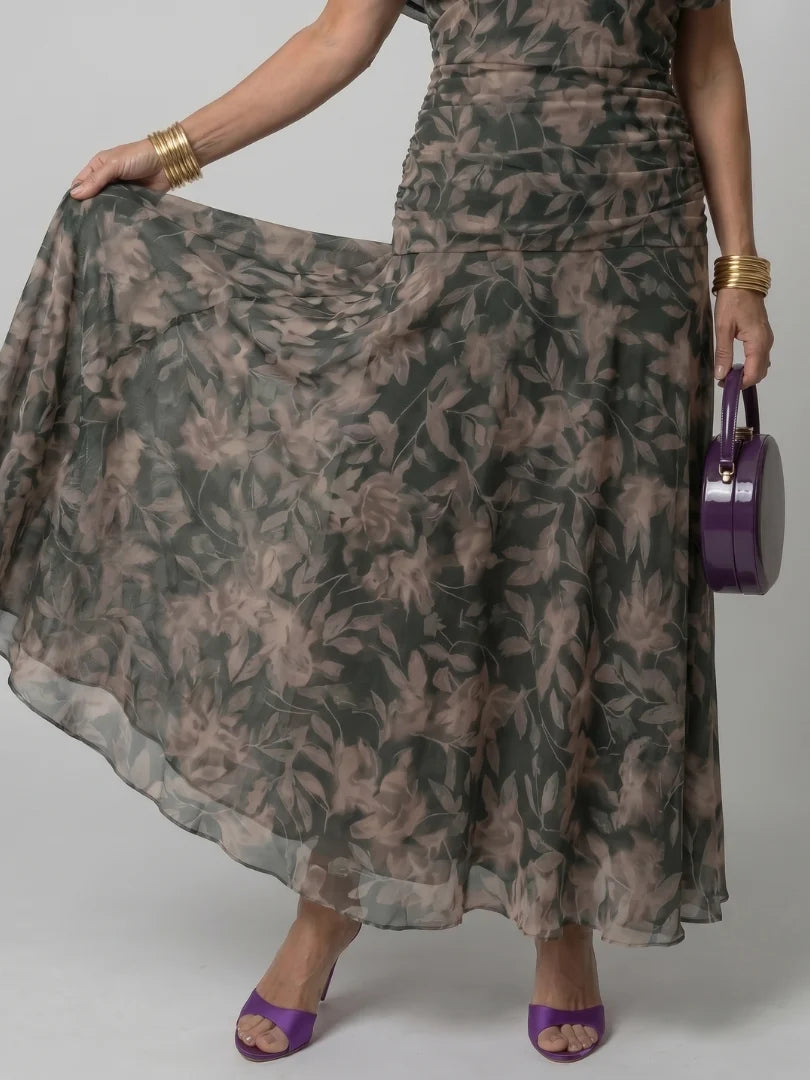 Full-length view of floral maxi dress styled with heeled sandals