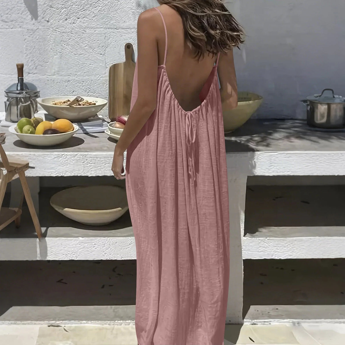 Lifestyle image of the Elegant And Comfortable Open-Back Lounge Dress styled for relaxed evening lounging