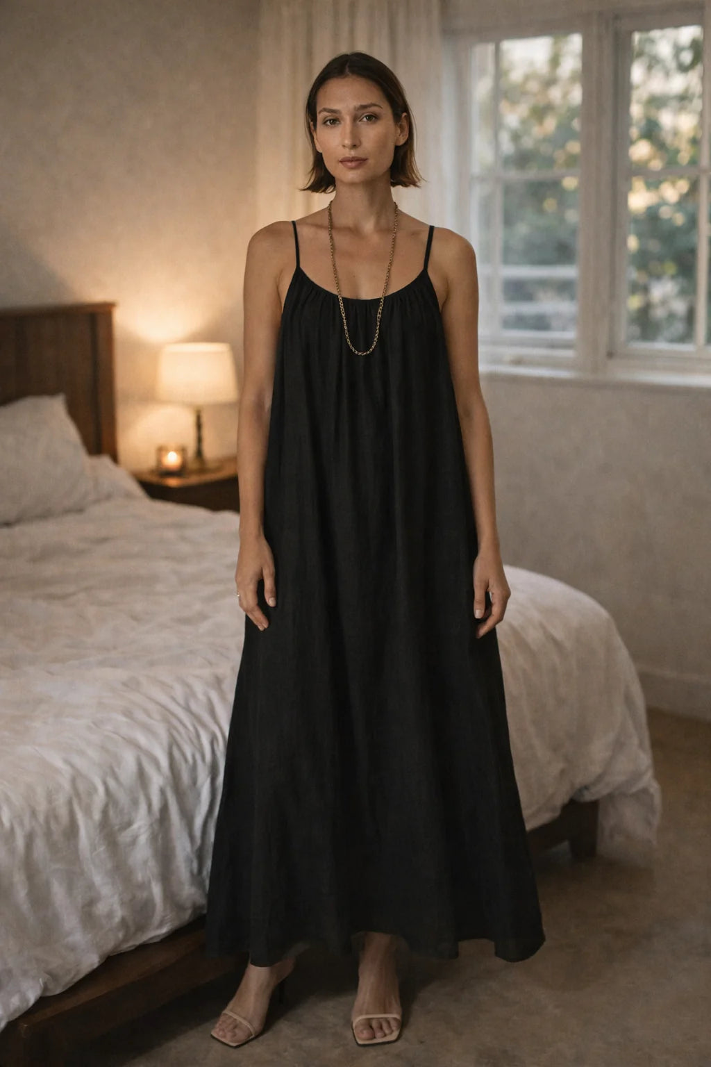 The Elegant And Comfortable Open-Back Lounge Dress shown in movement, highlighting the flowing maxi length