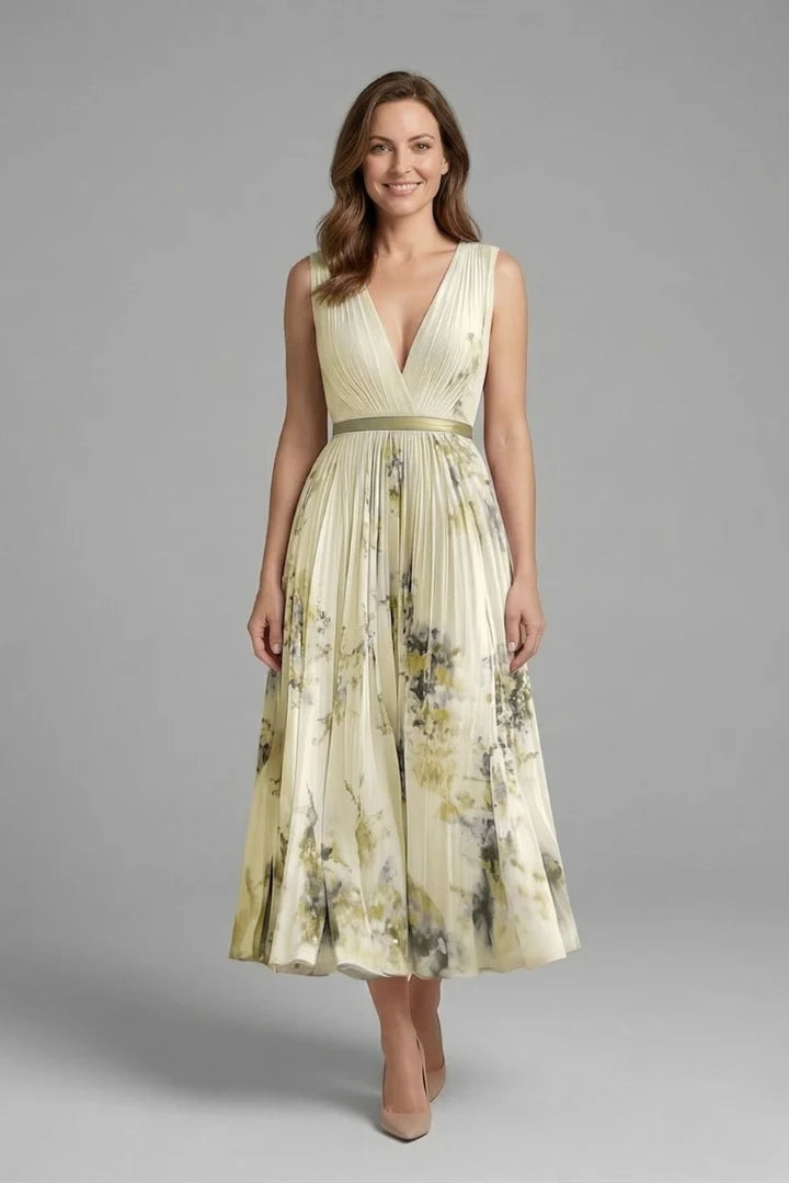Close-up of the delicate floral print pattern on the lightweight woven fabric of the dress