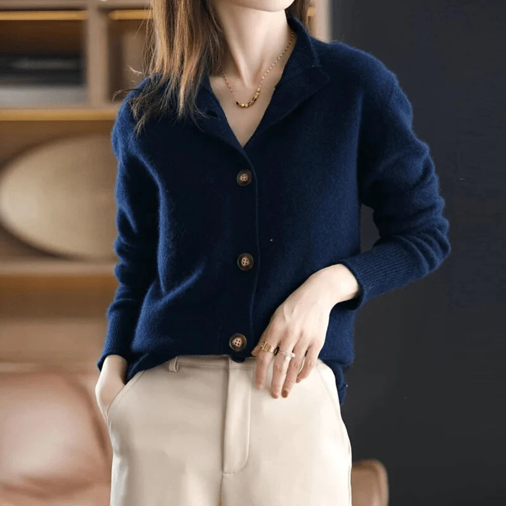 Detail shot of ribbed cuffs and hem on women's button-front knit cardigan